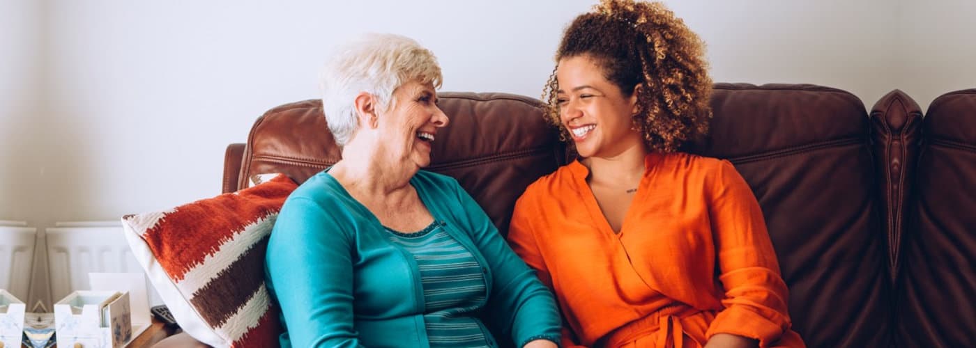 caregiver and a senior woman having conversation